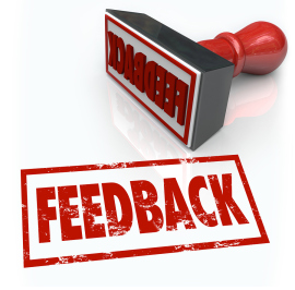 A red rubber stamp with the word Feedback to illustrate comments